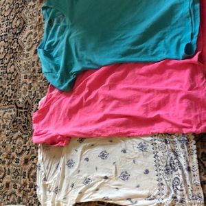 Three slightly worn tees.